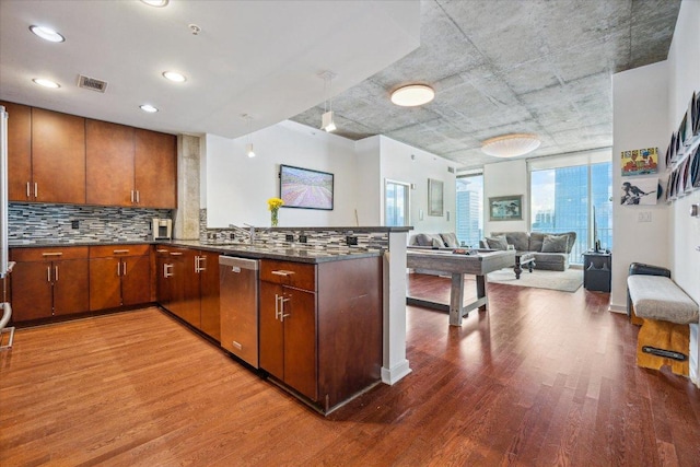 360 Nueces St Unit 3309, Austin, TX 78701 - kitchen with dishwasher, light wood-type flooring, a peninsula, backsplash, and open floor plan
