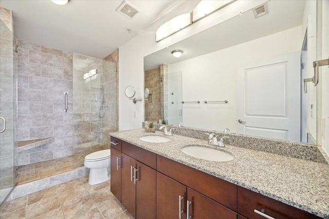 360 Nueces St Unit 3309, Austin, TX 78701 - full bath with double vanity, a stall shower, toilet, and tile patterned floors