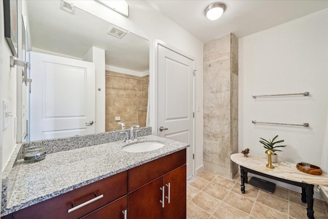 360 Nueces St Unit 3309, Austin, TX 78701 - full bathroom featuring vanity and tile patterned floors