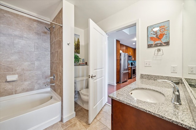 360 Nueces St Unit 3309, Austin, TX 78701 - full bathroom with toilet, vanity, washtub / shower combination, tile patterned floors, and baseboards