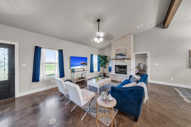 200 County Road 358, Granger, TX 76530 - living area featuring a ceiling fan, finished concrete flooring, a fireplace, baseboards, and beamed ceiling