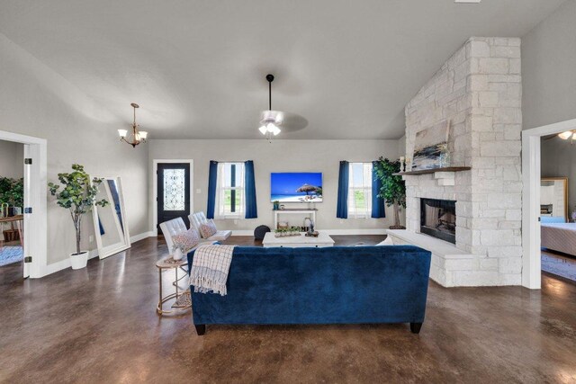 200 County Road 358, Granger, TX 76530 - living room with concrete floors, a fireplace, ceiling fan, a chandelier, and high vaulted ceiling