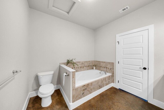 200 County Road 358, Granger, TX 76530 - full bathroom featuring toilet, a garden tub, baseboards, and concrete flooring