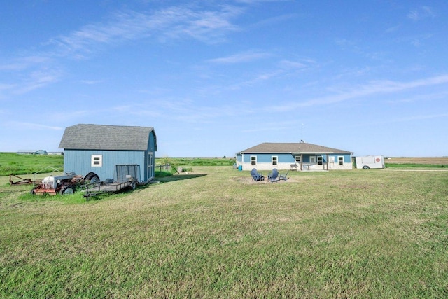 200 County Road 358, Granger, TX 76530 - view of grassy yard featuring a barn, an outbuilding, and a view of rural / pastoral area