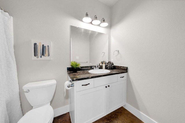 200 County Road 358, Granger, TX 76530 - bathroom featuring vanity, toilet, and baseboards