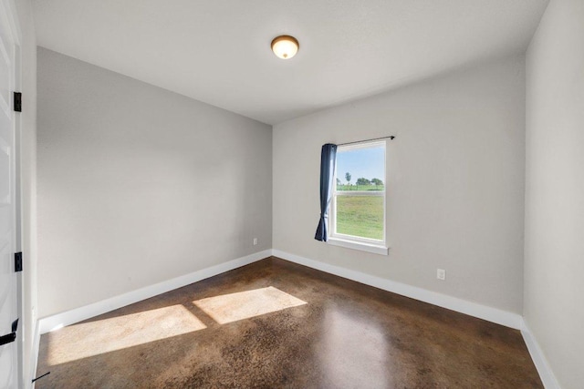 200 County Road 358, Granger, TX 76530 - empty room featuring finished concrete floors and baseboards
