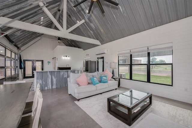 2543 Fm 975, Caldwell, TX 77836 - living room with a ceiling fan, concrete flooring, a wall mounted air conditioner, beamed ceiling, and high vaulted ceiling