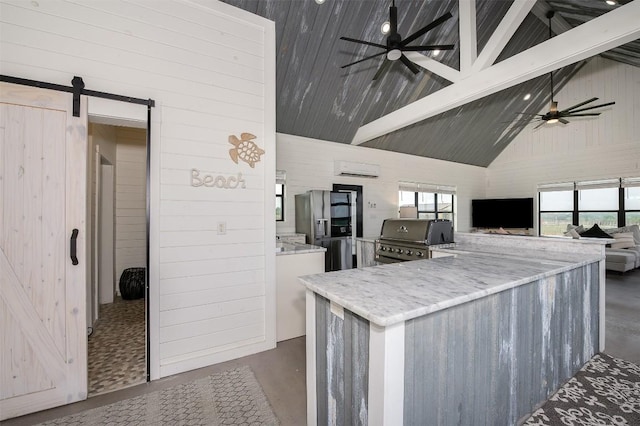 2543 Fm 975, Caldwell, TX 77836 - kitchen featuring finished concrete flooring, a barn door, ceiling fan, high vaulted ceiling, and stainless steel refrigerator with ice dispenser