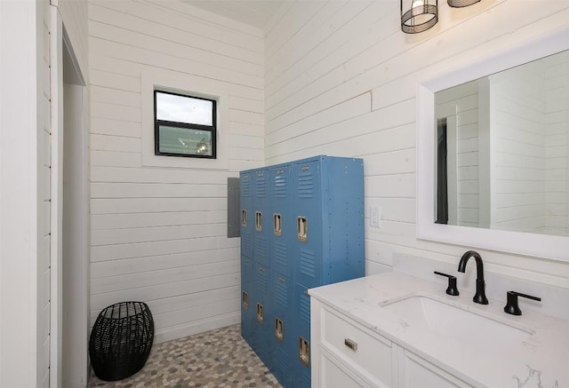 2543 Fm 975, Caldwell, TX 77836 - bathroom with wooden walls, vanity, and tile patterned floors