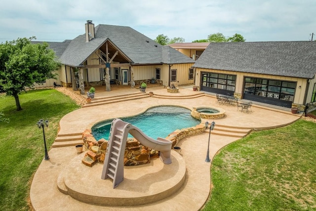 2543 Fm 975, Caldwell, TX 77836 - swimming pool featuring a lawn, a patio area, a water slide, an in-ground hot tub, and an outdoor structure