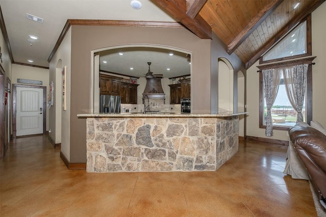 2543 Fm 975, Caldwell, TX 77836 - kitchen featuring appliances with stainless steel finishes, arched walkways, recessed lighting, decorative backsplash, and dark brown cabinets