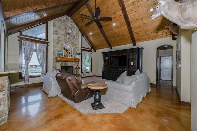 2543 Fm 975, Caldwell, TX 77836 - living room with wooden ceiling with exposed beams, a fireplace, ceiling fan, high vaulted ceiling, and baseboards