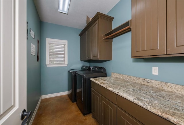 2543 Fm 975, Caldwell, TX 77836 - laundry room featuring washer and clothes dryer, cabinet space, baseboards, and tile patterned flooring