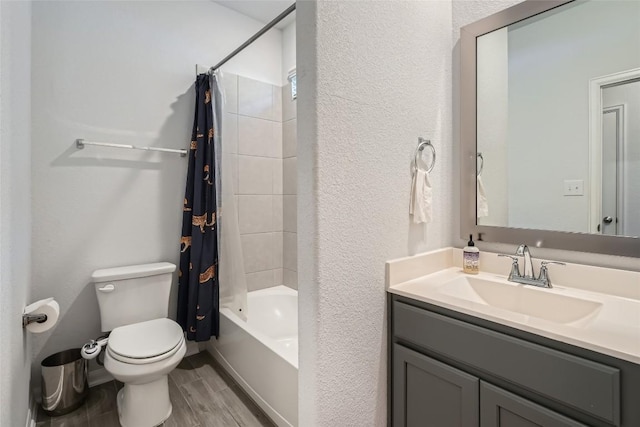 267 Razzmatazz Trl, Buda, TX 78610 - full bath featuring toilet, vanity, wood finished floors, shower / tub combo, and a textured wall