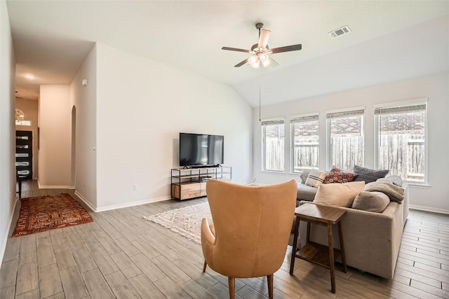 267 Razzmatazz Trl, Buda, TX 78610 - living room featuring wood finished floors, baseboards, ceiling fan, and vaulted ceiling