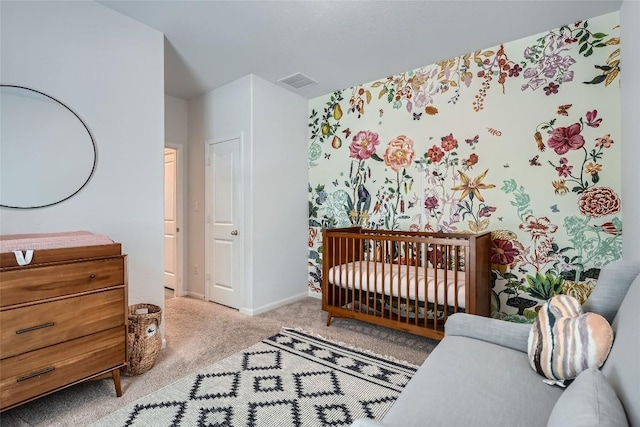 267 Razzmatazz Trl, Buda, TX 78610 - bedroom featuring carpet, baseboards, and a crib