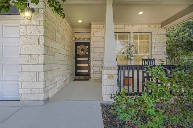 267 Razzmatazz Trl, Buda, TX 78610 - view of exterior entry with a porch and stone siding