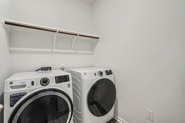 267 Razzmatazz Trl, Buda, TX 78610 - washroom featuring separate washer and dryer and baseboards