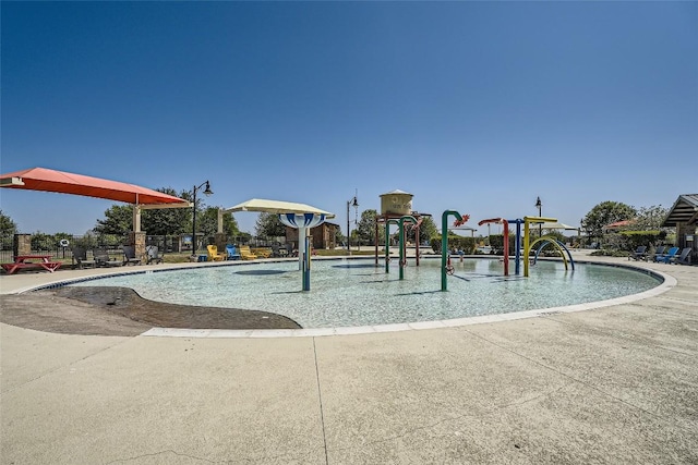 267 Razzmatazz Trl, Buda, TX 78610 - view of swimming pool with a water play area