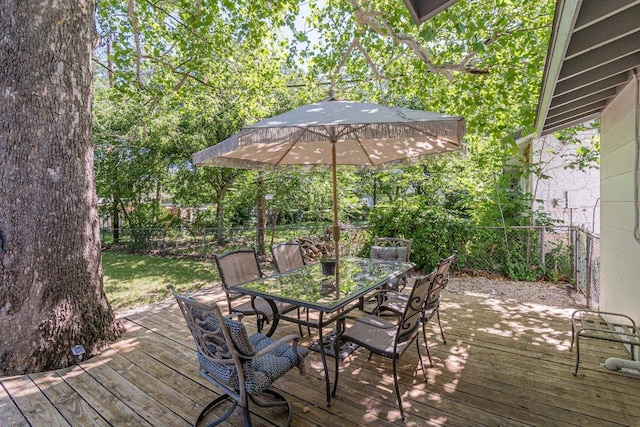 4714 Philco Dr, Austin, TX 78745 - wooden terrace with outdoor dining space and a fenced backyard