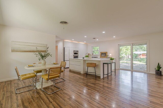 4714 Philco Dr, Austin, TX 78745 - dining area featuring wood finished floors and recessed lighting