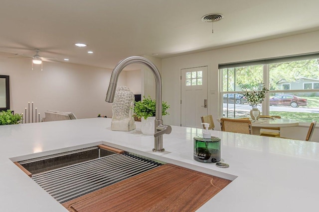 4714 Philco Dr, Austin, TX 78745 - kitchen view of ceiling fan, recessed lighting, and light countertops