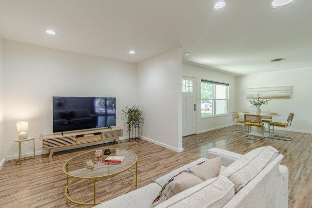 4714 Philco Dr, Austin, TX 78745 - living area featuring wood finished floors, baseboards, and recessed lighting