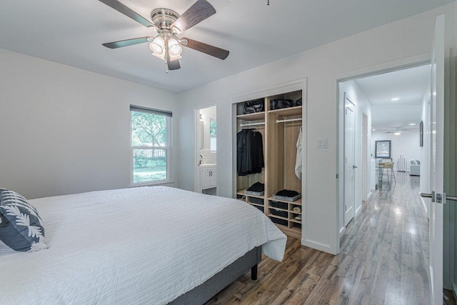 4714 Philco Dr, Austin, TX 78745 - bedroom with wood finished floors, a closet, ensuite bath, and a ceiling fan