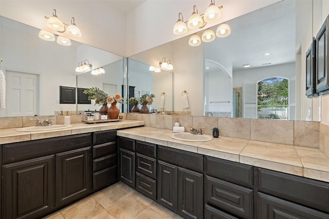 8311 Sumner Ct, Austin, TX 78733 - full bathroom with double vanity, tile patterned flooring, and an enclosed shower