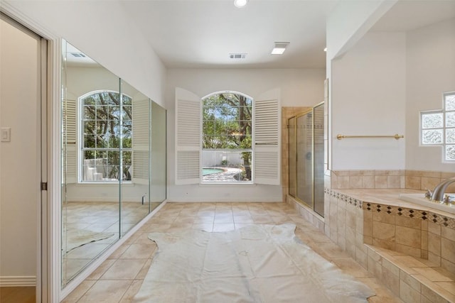 8311 Sumner Ct, Austin, TX 78733 - bathroom with a garden tub, tile patterned floors, a tile shower, and recessed lighting