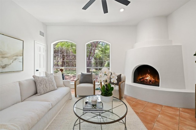 8311 Sumner Ct, Austin, TX 78733 - tiled living area featuring ceiling fan, a fireplace, and recessed lighting