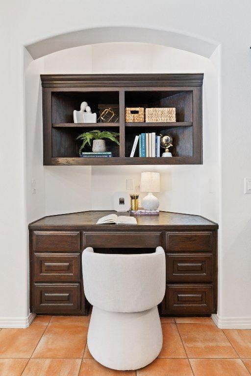 8311 Sumner Ct, Austin, TX 78733 - home office featuring built in desk and light tile patterned floors