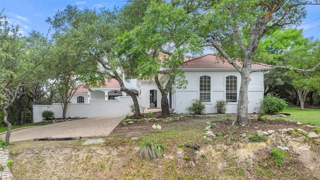 8311 Sumner Ct, Austin, TX 78733 - mediterranean / spanish-style home featuring a tiled roof and stucco siding