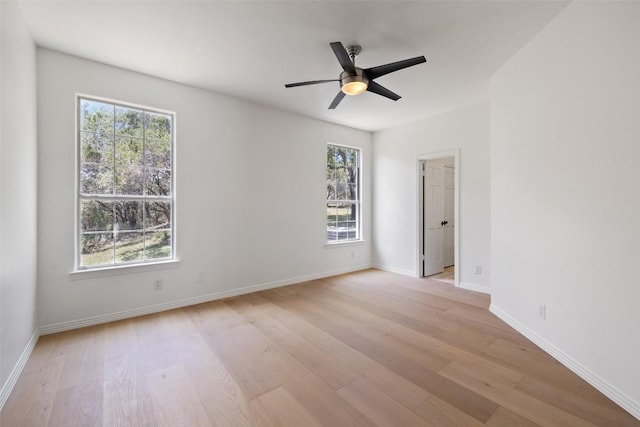 8311 Sumner Ct, Austin, TX 78733 - unfurnished room with healthy amount of natural light, light wood-style floors, and a ceiling fan