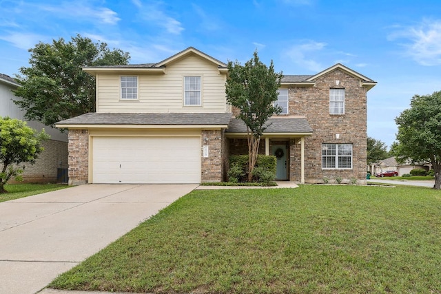 1609 Churchill Cv, Cedar Park, TX 78613 - traditional-style house featuring an attached garage, a front lawn, driveway, roof with shingles, and brick siding