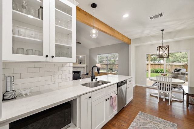 1609 Churchill Cv, Cedar Park, TX 78613 - kitchen with a sink, dishwasher, tasteful backsplash, decorative light fixtures, and dark wood-type flooring
