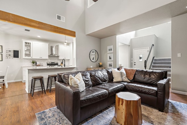 1609 Churchill Cv, Cedar Park, TX 78613 - living area with wood finished floors, stairs, ceiling fan, baseboards, and recessed lighting