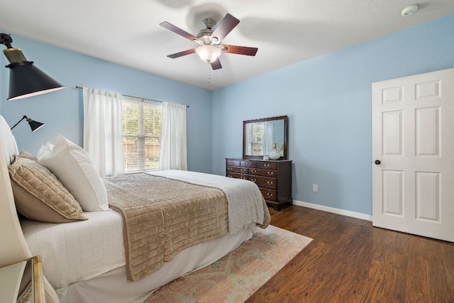 1609 Churchill Cv, Cedar Park, TX 78613 - bedroom with dark wood-style flooring, baseboards, and ceiling fan