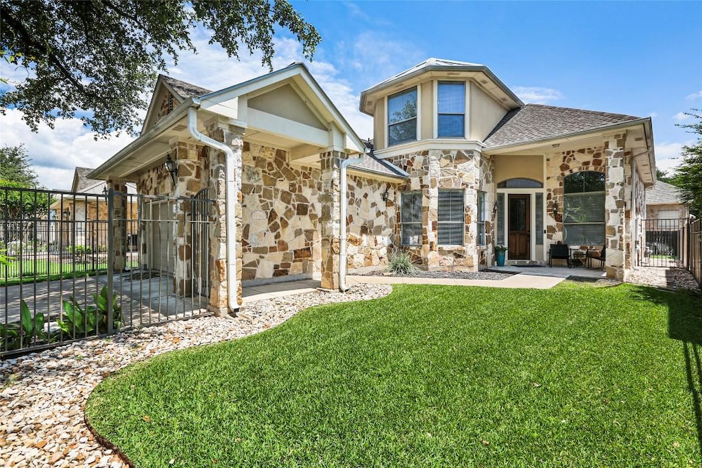 2518 Moray Ln, Cedar Park, TX 78613 - rear view of house with a gate and stone siding