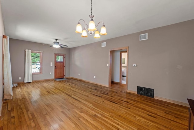 4314 Duval St, Austin, TX 78751 - unfurnished living room with a chandelier, light wood-style floors, a ceiling fan, and baseboards