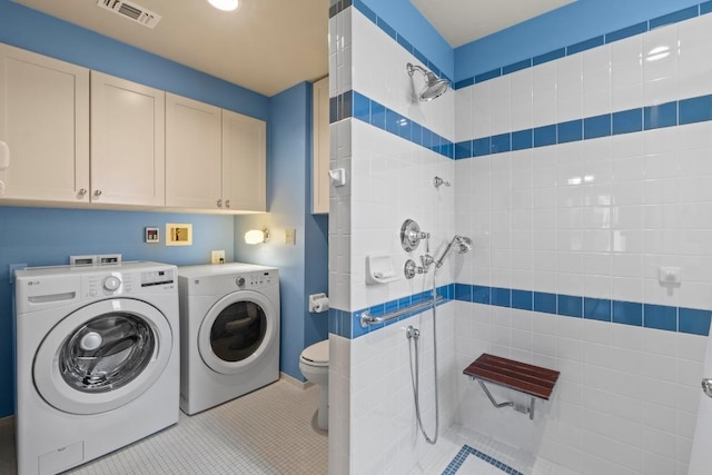 4314 Duval St, Austin, TX 78751 - laundry room featuring washing machine and dryer and tile patterned flooring