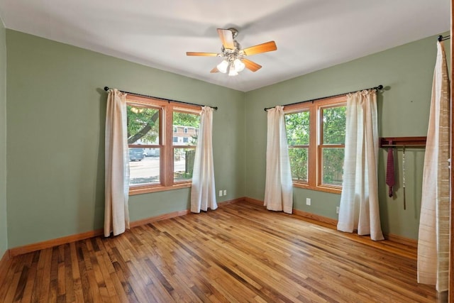 4314 Duval St, Austin, TX 78751 - empty room with plenty of natural light, hardwood / wood-style flooring, and ceiling fan