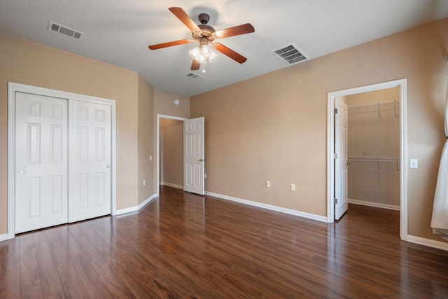 3809 Bronco Bend Loop, Austin, TX 78744 - unfurnished bedroom with a closet, wood finished floors, and baseboards