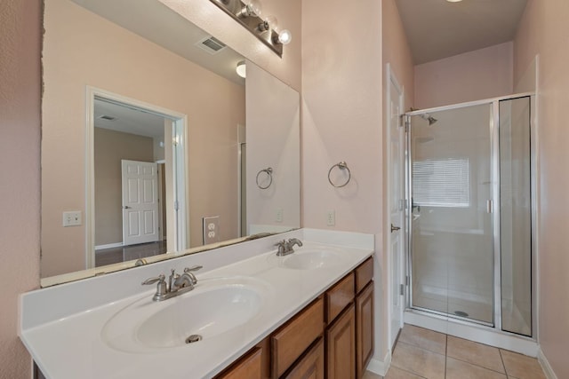 3809 Bronco Bend Loop, Austin, TX 78744 - full bathroom with double vanity, tile patterned floors, and a shower stall