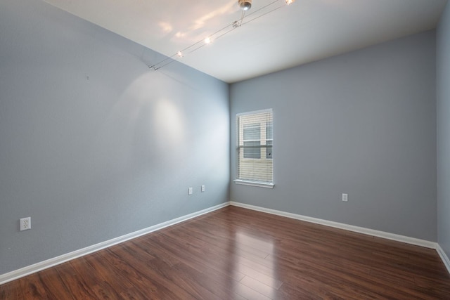 3809 Bronco Bend Loop, Austin, TX 78744 - empty room with dark wood-style flooring and baseboards