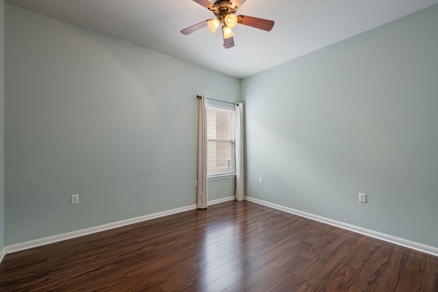 3809 Bronco Bend Loop, Austin, TX 78744 - spare room featuring dark wood-style flooring, baseboards, and ceiling fan