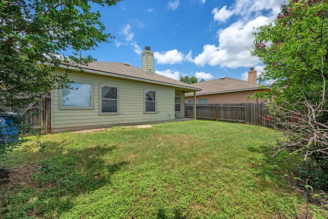 3809 Bronco Bend Loop, Austin, TX 78744 - rear view of house featuring a chimney