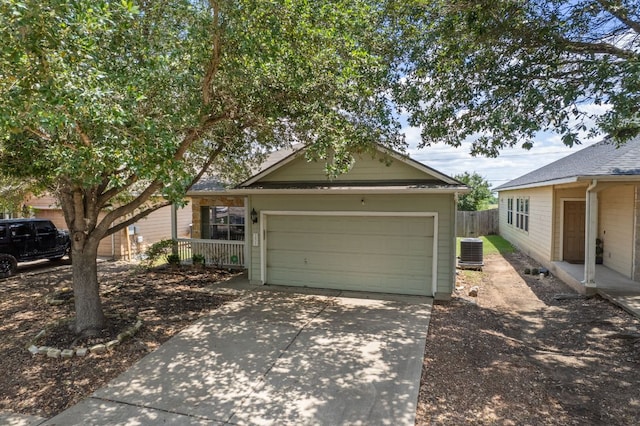 3809 Bronco Bend Loop, Austin, TX 78744 - view of front facade with driveway, central AC unit, and an attached garage