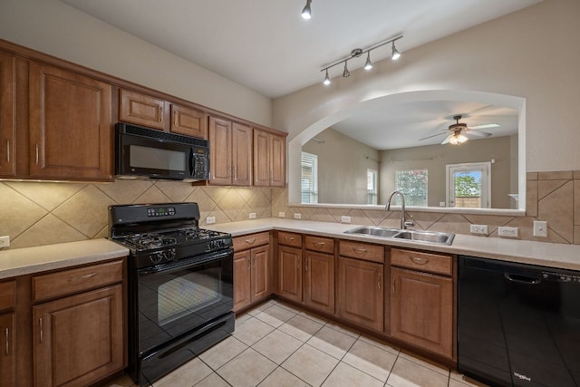 3809 Bronco Bend Loop, Austin, TX 78744 - kitchen featuring black appliances, a sink, light countertops, decorative backsplash, and a ceiling fan
