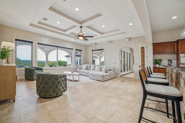 12529 Verandah Ct, Austin, TX 78726 - living room with ceiling fan, coffered ceiling, arched walkways, recessed lighting, and beamed ceiling